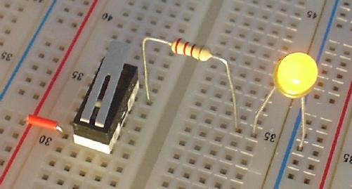 Idle-side contact of switch lights up a LED